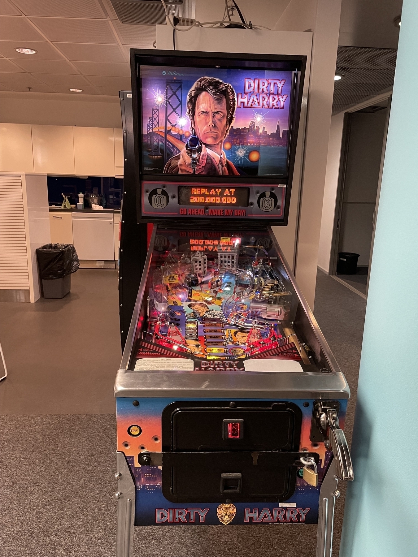 A “Dirty Harry” pinball machine in an office environment 